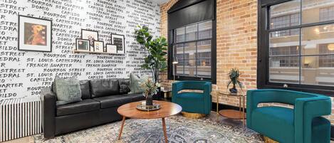 Relax in the living area with a smart TV, stylish seating, and a sleeper sofa for extra guests. Perfect for families or group stays in New Orleans, this inviting space is ideal for movie nights or recharging after a day in the city.