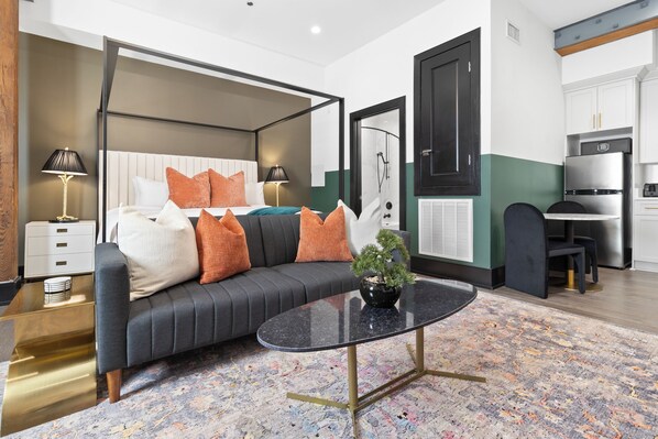 Relax in the living area with a smart TV, stylish seating, and a sleeper sofa for extra guests. Perfect for families or group stays in New Orleans, this inviting space is ideal for movie nights or recharging after a day in the city.