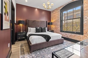 Retreat to the Primary bedroom with a plush king bed, walk-in closet, blackout shades, and a smart TV. Designed for comfort and privacy, this suite is perfect for recharging after a day exploring New Orleans.
