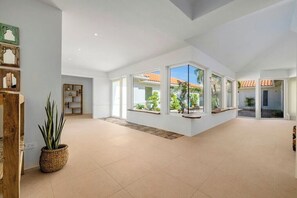 Indoors, offering a glimpse of the outside surroundings.