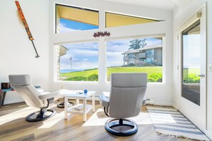 Recliner chairs in the living room, perfectly positioned by the window for relaxation and views.
