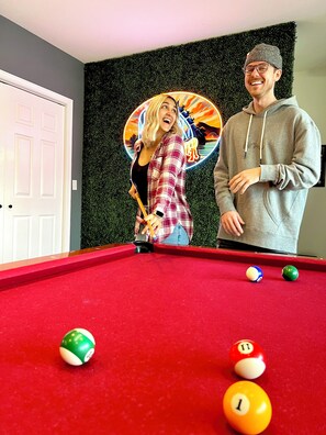 Grab your friends and family for a game of pool with a beautiful lakeside view