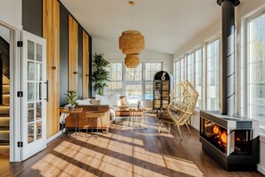 Step inside the home and be greeted by this warm, light-filled sun room. 