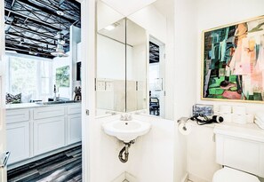 The bathroom offers modern elegance, making every moment feel like a retreat.