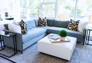 Relax in a stylish living room where every detail speaks of comfort and sophistication.