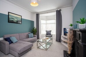Step into our spacious living room, designed for comfort and relaxation.