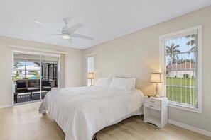 Wake up to serene views and step right out to the pool from this cozy bedroom!