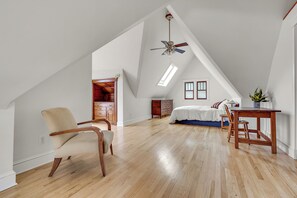 The third-floor main bedroom has 14 ft. lofted ceilings and two large skylights.