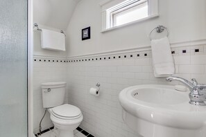 A private third-floor bathroom with a balcony is located in the master bedroom.