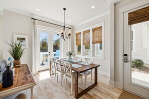 Enjoy casual meals or morning coffee in this bright and airy kitchen nook with a direct view of the backyard.