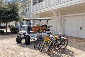 Check out this 6 seater golf cart and 5 bikes, yours for your stay