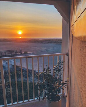 Spend your mornings watching the sunrise over the ocean from the balcony with coffee in hand