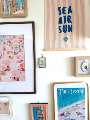 Thoughtfully curated gallery wall brings a touch of nostalgic Wildwood charm to your stay