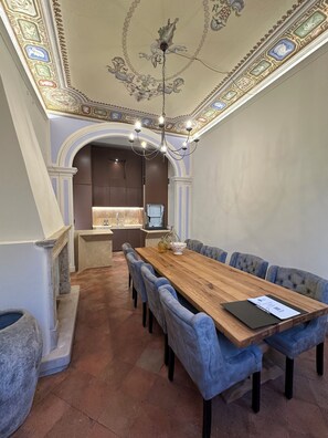 The dining room adjacent to the kitchen can comfortably sit 8 people.