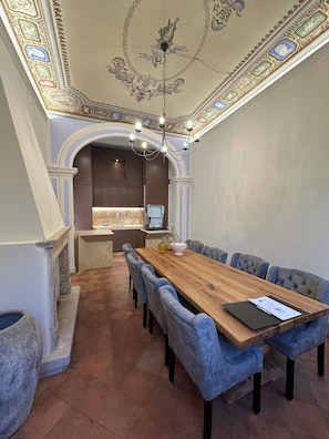 The dining room adjacent to the kitchen can comfortably sit 8 people.