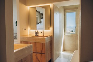 Bathroom #1 with his/her sinks, shower, and soaking tub.