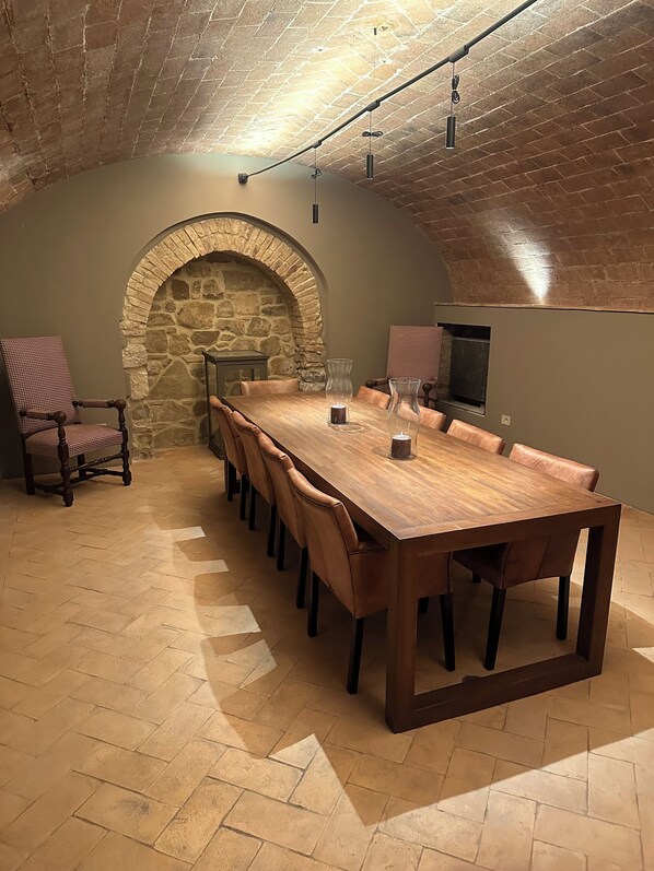 Wine cellar tasting room in the lower level of the home which seats 10.