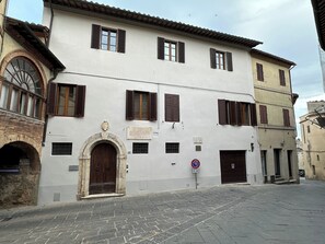 This is the exterior of the building and the garage door is on the right.