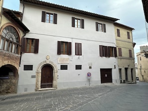 This is the exterior of the building and the garage door is on the right.