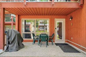 Ground-floor, walkout patio with a BBQ & outdoor seating.