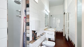 Modern bathroom consisting of a shower and a bathtub