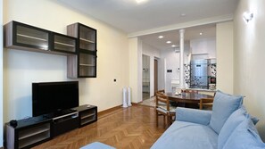 Large bright living room with dining table