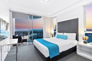 The primary bedroom comes with a queen-sized bed, second TV and access to a second balcony where you can soak up breezy, riverfront vistas.