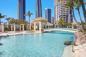 Kick back beside a beautiful lagoon swimming pool, set among lush tropical grounds.