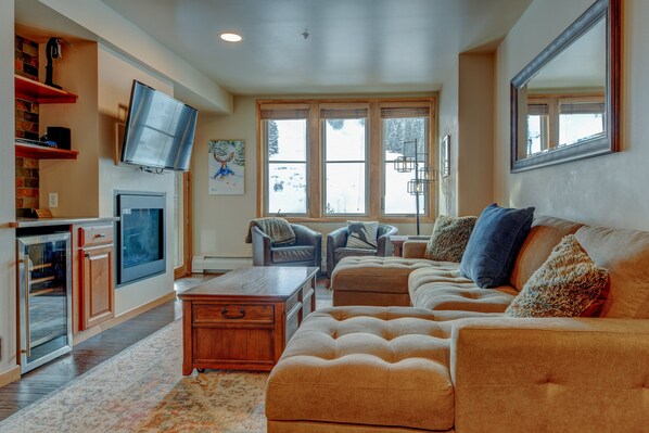 Living Area With 50" HD TV,  Gas Fireplace and Wine Fridge