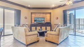 Seating area with large TV.