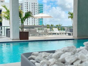 Rooftop Pool Area | Features two heated pools + lounge.