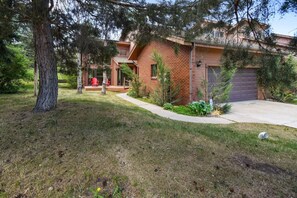 Front exterior of home with plenty of parking in garage and driveway