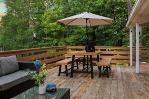 Spacious deck with al fresco dining and outdoor seating.