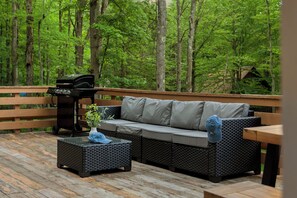 Outdoor seating and BBQ grill.