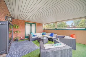 Patio: Lower patio equipped with multiple yard games, a TV to watch your favorite shows, and a relaxing natural lighting.