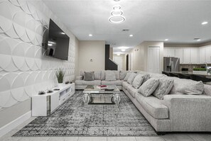 FIRST FLOOR Living room: it has a comfortable sofa 🛋️ and a TV .