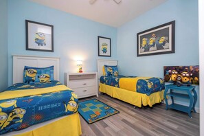 Minions-Themed Bedroom – A fun-filled room with two twin beds and bright yellow and blue Minion décor!