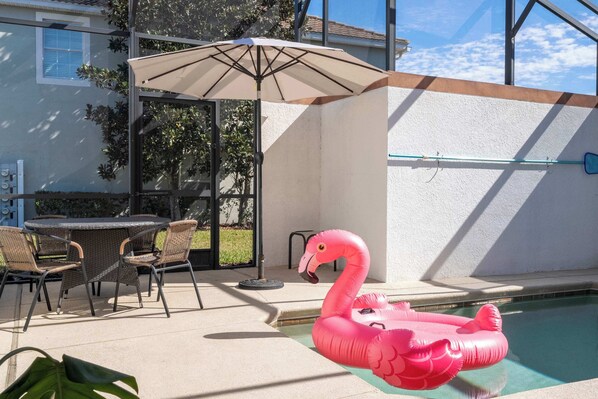 Your private oasis awaits! 🌴 A corner townhome with screened pool in Storey Lake Resort.