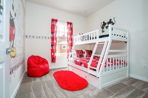 Bunk bed with trundle bed below the bottom bunk.
