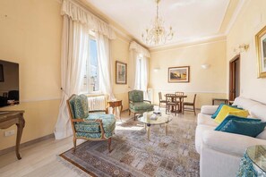 Luminous living room blends comfort and charm.