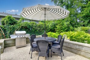 Patio with outdoor dining space and BBQ grill