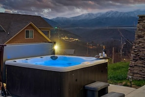 Relax in the hot tub while enjoying the serene surroundings.