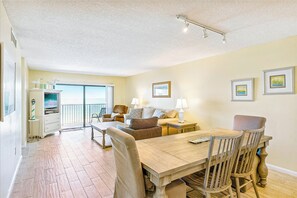 Gather with family and friends in this spacious, beautifully lit living area.