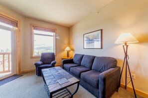 Living Room has private deck and expanisve views of the Sherwin Mountains