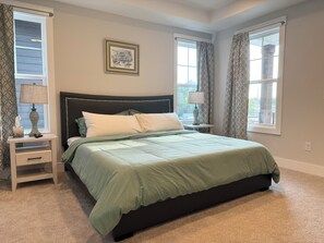 2nd floor master bedroom with a king bed 