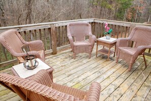 Step out onto the private deck to enjoy the whispering tranquility of the woods that surround you. Our comfortable wicker seating area is the perfect spot for your morning coffee or an evening glass of wine as you immerse yourself in the natural beauty.