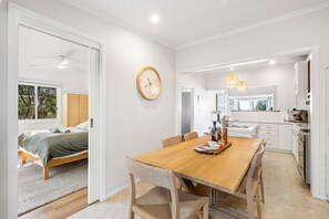Dining: comfortable 6 seater oak table . High chair available