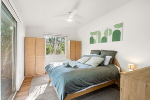 Bedroom two : Queen bed, block out blinds , sliding door access to back yard .