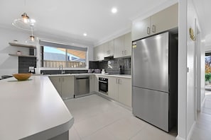 Kitchen + Coffee Machine + Breakfast Bar with Stools