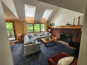 Living room with real wood fire place, HDTV